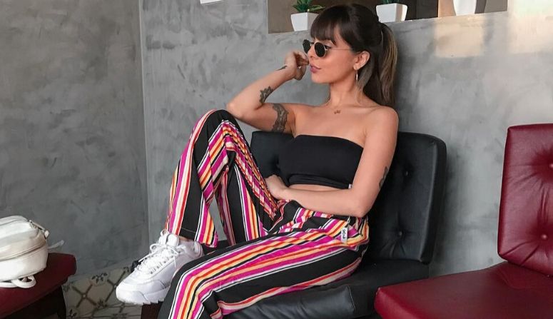 40 looks com calça listrada para fazer sucesso com a tendência